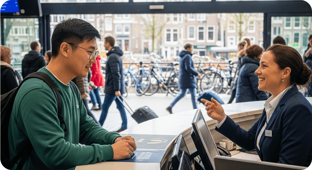 A traveler using Dutch to buy tickets at the Amsterdam Centraal train station.
